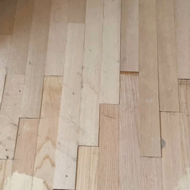 Precision lace-in hardwood floor patching in progress after carpet removal