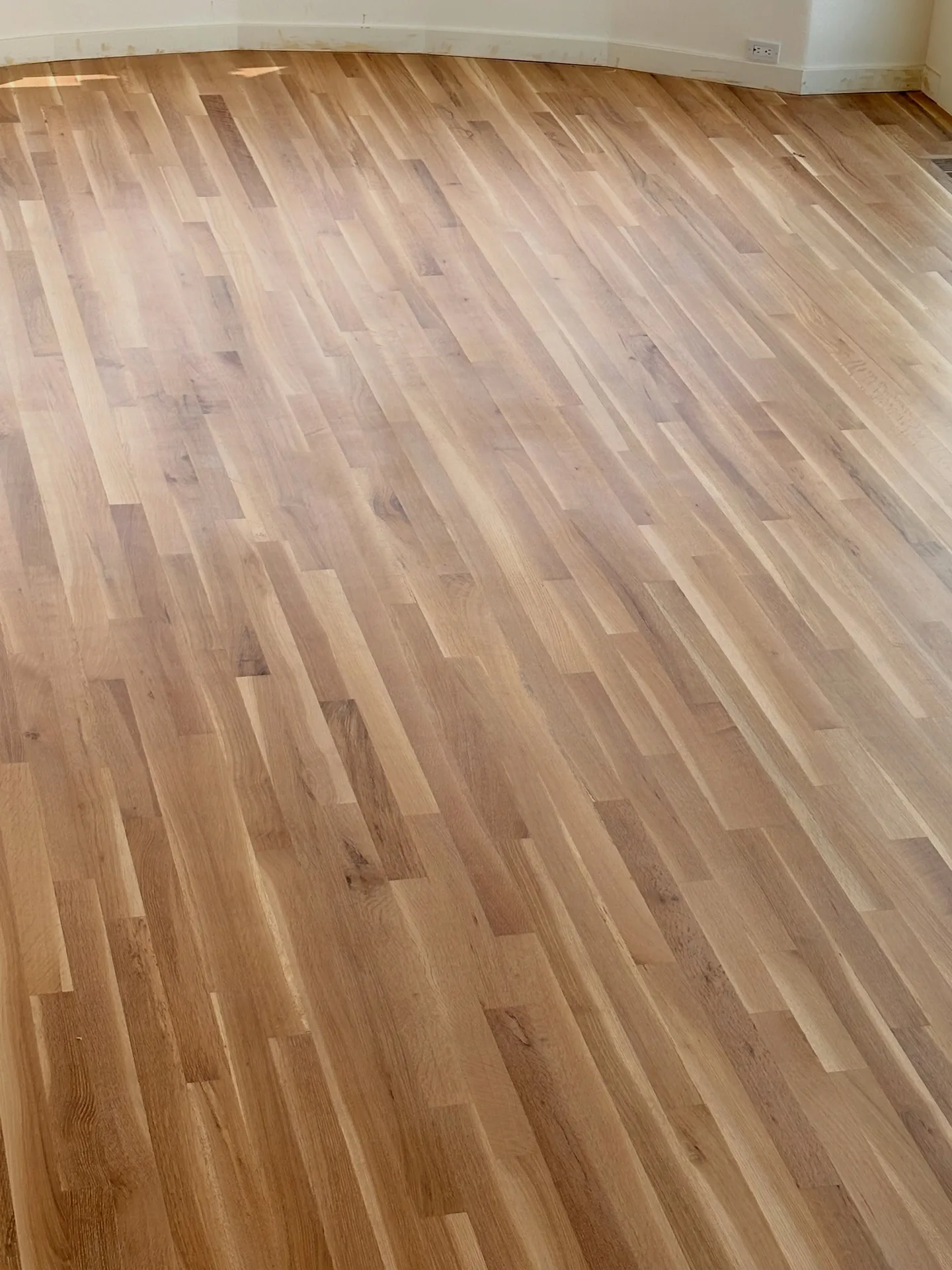 Seamlessly repaired and refinished red oak living room floor in Mt. Tabor